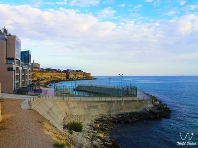 Aktau City By The Sea Stock Photo - Download Image Now - Beach, Beacon,  Building Exterior - iStock картинки